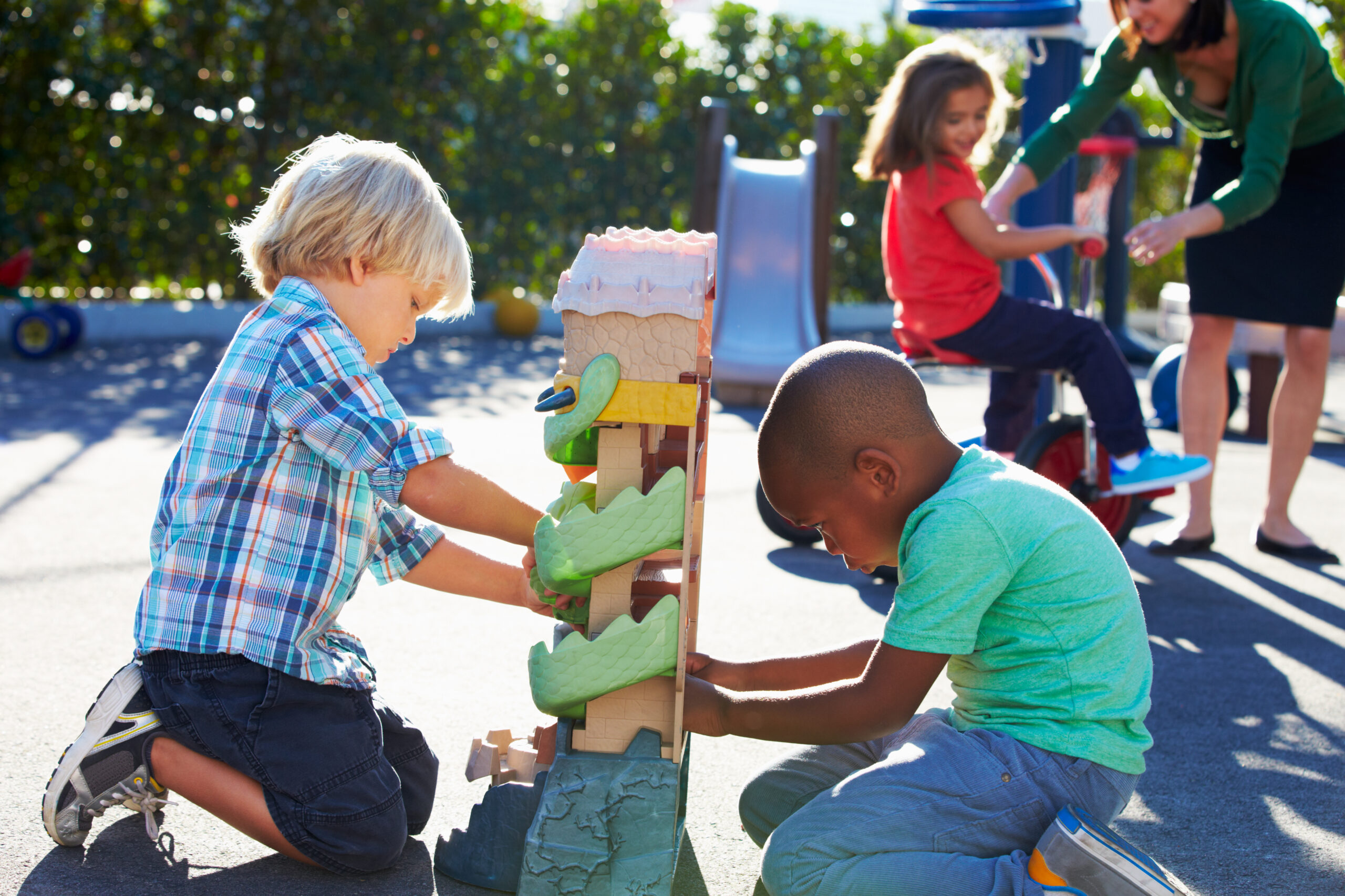 Two,Boys,Playing,With,Toy,In,Playground
